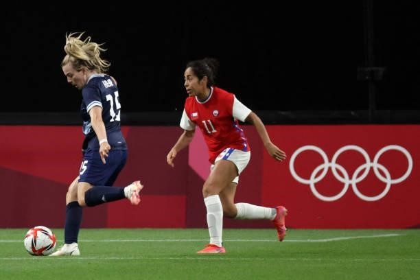 Britain's forward Lauren Hemp shoots next to Chile's midfielder Yessenia Lopez during the Tokyo 2020 Olympic Games women's group E first round...