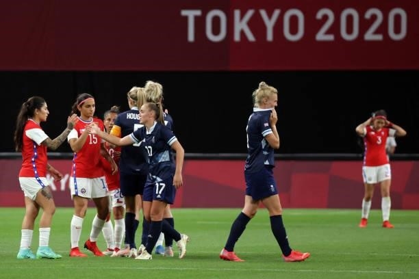 Chile's players congratulate Britain's players for their victory at the end of the Tokyo 2020 Olympic Games women's group E first round football...
