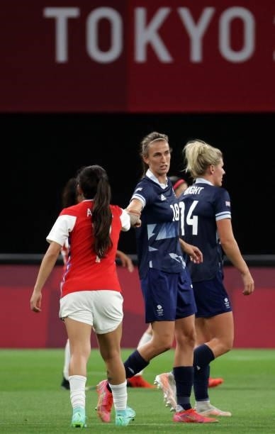 Chile's forward Yenny Acuna congratulates Britain's midfielder Jill Scott at the end of the Tokyo 2020 Olympic Games women's group E first round...