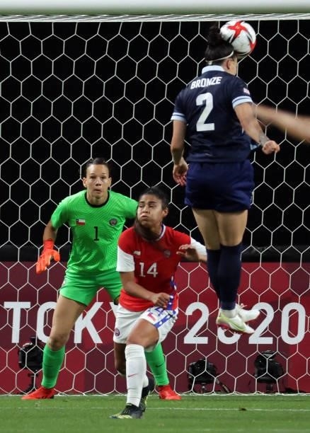 Britain's defender Lucy Bronze heads the ball in front of Chile's goalkeeper Christiane Endler and Chile's defender Daniela Pardo during the Tokyo...