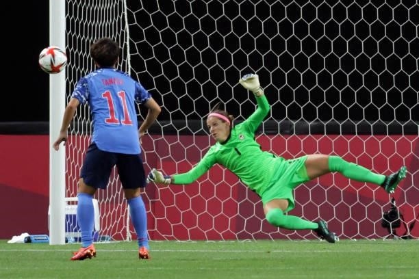 Canada's goalkeeper Stephanie Labbe saves a penalty shot by Japan's forward Mina Tanaka during the Tokyo 2020 Olympic Games women's group E first...