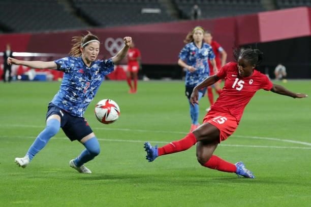Japan's defender Risa Shimizu challeges Canada's forward Nichelle Prince during the Tokyo 2020 Olympic Games women's group E first round football...