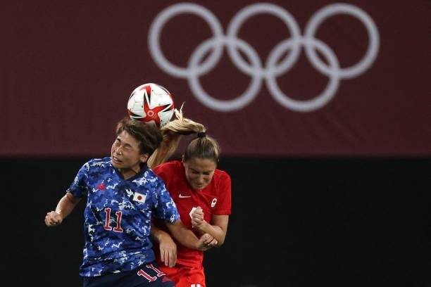 Japan's forward Mina Tanaka vies with Canada's defender Shelina Zadorsky during the Tokyo 2020 Olympic Games women's group E first round football...