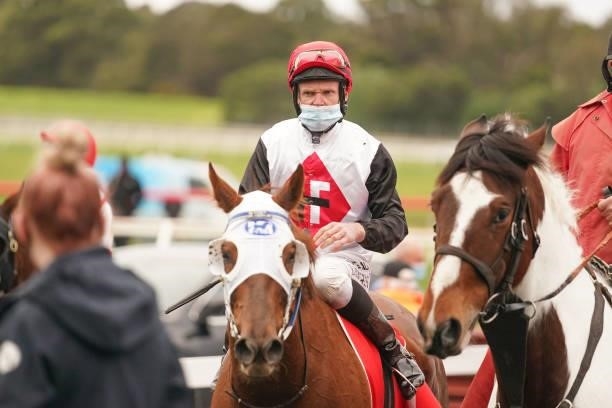 Perennial ridden by Brian Higgins returns to the mounting yard after winning the Ladbrokes Cash In Handicap at Ladbrokes Park Lakeside Racecourse on...