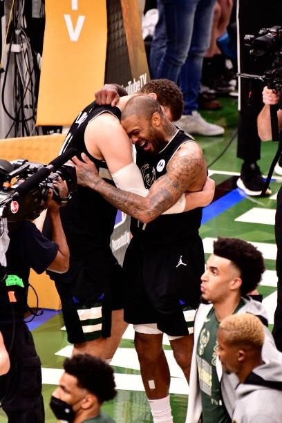 Brook Lopez and P.J. Tucker of the Milwaukee Bucks hug after winning Game Six of the 2021 NBA Finals against the Phoenix Suns on July 20, 2021 at the...