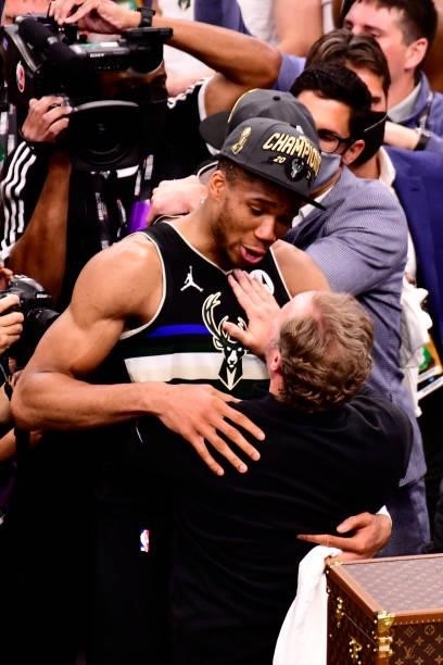 Giannis Antetokounmpo and Head Coach, Mike Budenholzer of the Milwaukee Bucks share a conversation after winning Game Six of the 2021 NBA Finals...
