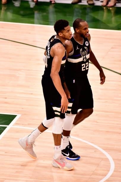 Giannis Antetokounmpo and Khris Middleton of the Milwaukee Bucks look on against the Phoenix Suns during the 2021 NBA Finals on July 20, 2021 at the...