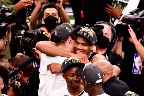 Giannis Antetokounmpo hugs Brook Lopez of the Milwaukee Bucks after winning Game Six of the 2021 NBA Finals against the Phoenix Suns on July 20, 2021...