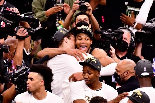 Giannis Antetokounmpo hugs Brook Lopez of the Milwaukee Bucks after winning Game Six of the 2021 NBA Finals against the Phoenix Suns on July 20, 2021...