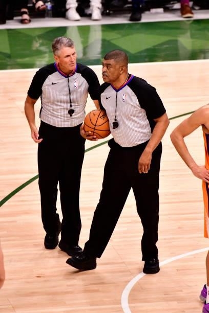Scott Foster and Tony Brothers share a conversation during Game Six of the 2021 NBA Finals between the Phoenix Suns and the Milwaukee Bucks on July...