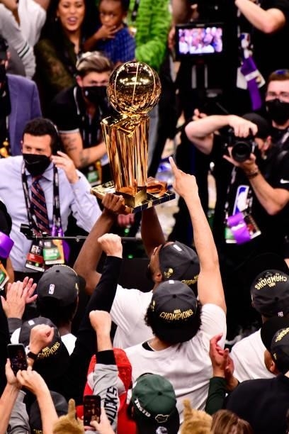 The Milwaukee Bucks hoist up the Larry O'Brien Trophy after winning Game Six of the 2021 NBA Finals against the Phoenix Suns on July 20, 2021 at the...