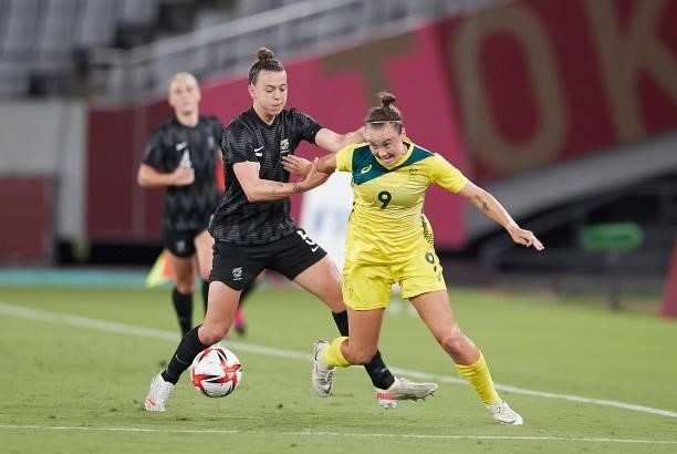 Caitlin Foord of Australia and Meikayla Moore of New Zealand battle for the ball in the Women's First Round Group G match between Australia and New...