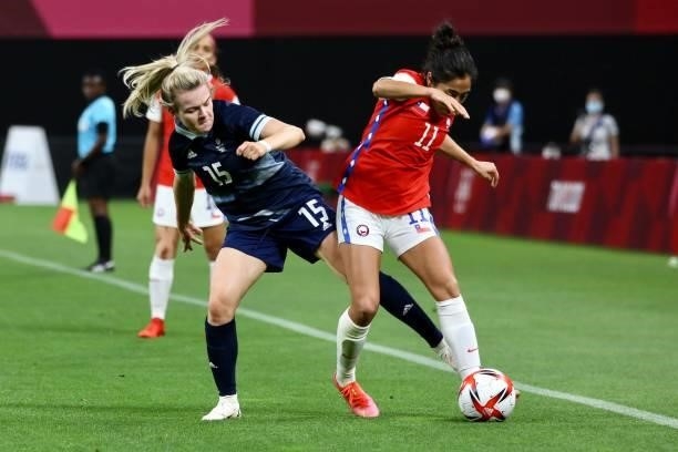 Lauren Hemp of Team Great Britain is challenged by LOPEZ Yessenia of Team Chile during the Women's First Round Group E match between Great Britain...