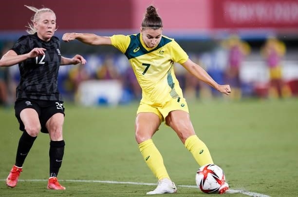 Steph Catley of Australia and Betsy Hassett of New Zealand battle for the ball in the Women's First Round Group G match between Australia and New...