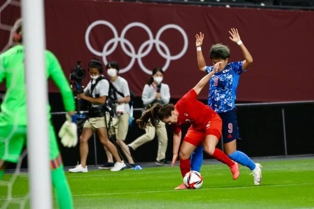 Yuika ¦ of Team Japan battles for possession with CHAPMAN Allysha of Team Canada during the Women's First Round Group E match between Japan and...