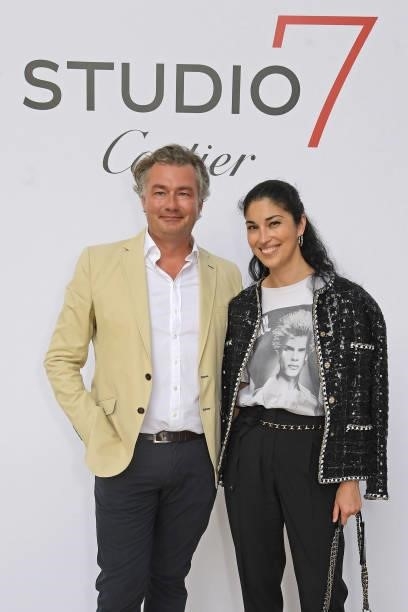 Managing Director of Cartier Ltd Laurent Feniou and Caroline Issa attend a private view of "Studio 7 By Cartier
