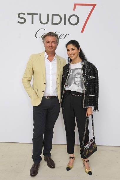 Managing Director of Cartier Ltd Laurent Feniou and Caroline Issa attend a private view of "Studio 7 By Cartier