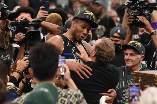 Head Coach Mike Budenholzer of the Milwaukee Bucks and Giannis Antetokounmpo celebrate after winning Game Six of the 2021 NBA Finals on July 20, 2021...