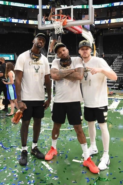 Bobby Portis, P.J. Tucker and Pat Connaughton of the Milwaukee Bucks celebrate after winning Game Six of the 2021 NBA Finals on July 20, 2021 at the...