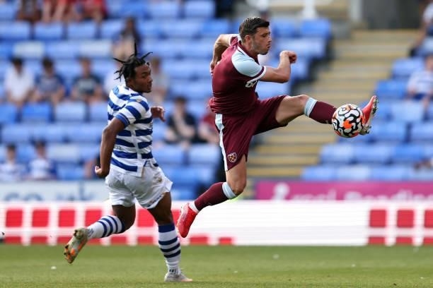 Aaron Cresswell of West Ham United in action with Femi Azeez of Reading during the pre-season friendly between Reading and West Ham United at...