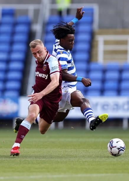 Jarrod Bowen of West Ham United tangles with Ovie Ejaria of Reading during the pre-season friendly between Reading and West Ham United at Madejski...