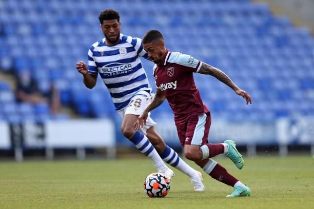Manuel Lanzini of West Ham United in action with Josh Laurent of Reading during the pre-season friendly between Reading and West Ham United at...
