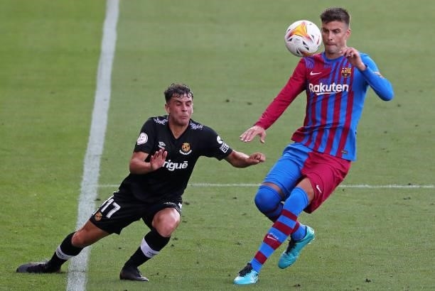 Gerard Pique and Prats during the friendly match between FC Barcelona and Club Gimnastic de Tarragona, played at the Johan Cruyff Stadium on 21th...