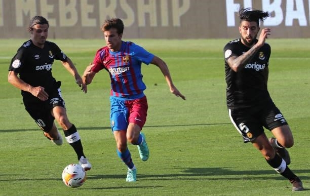 Ricky Puig, Fullana and Trilles during the friendly match between FC Barcelona and Club Gimnastic de Tarragona, played at the Johan Cruyff Stadium on...