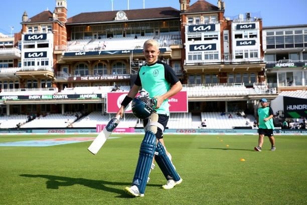 Sam Curran of the Oval Invincibles heads out to warm up ahead of The Hundred match between Oval Invincibles Men and Manchester Originals Men at The...