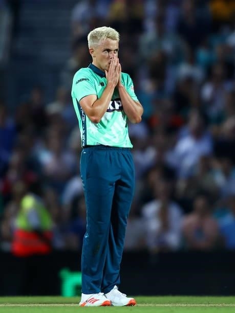 Sam Curran of the Oval Invincibles reacts during The Hundred match between Oval Invincibles Men and Manchester Originals Men at The Kia Oval on July...