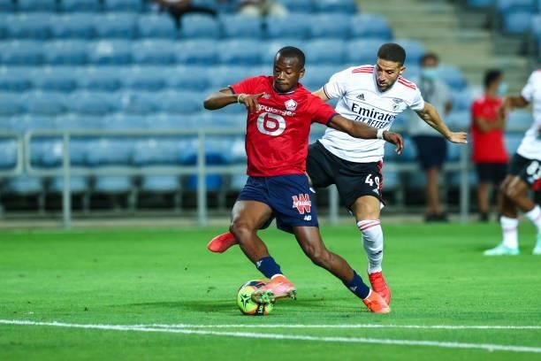 Tiago Djalo of LOSC Lille vies with Adel Taarabt of SL Benfica for the ball possession during the Pre-Season Friendly match between SL Benfica and...