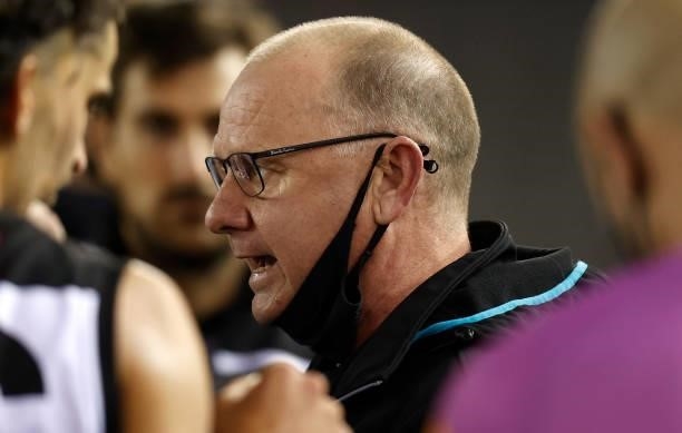 Ken Hinkley, Senior Coach of the Power addresses his players during the 2021 AFL Round 19 match between the Port Adelaide Power and the Collingwood...