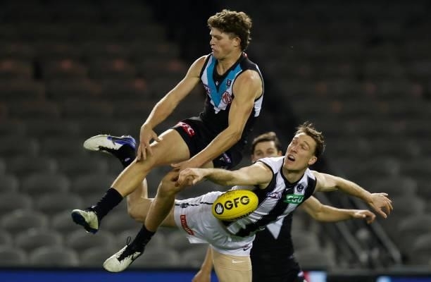 Mitch Georgiades of the Power and Jack Madgen of the Magpies in action during the 2021 AFL Round 19 match between the Port Adelaide Power and the...