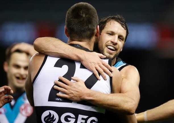 Charlie Dixon and Travis Boak of the Power celebrate during the 2021 AFL Round 19 match between the Port Adelaide Power and the Collingwood Magpies...