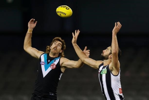 Scott Lycett of the Power and Brodie Grundy of the Magpies compete for the ball during the 2021 AFL Round 19 match between the Port Adelaide Power...