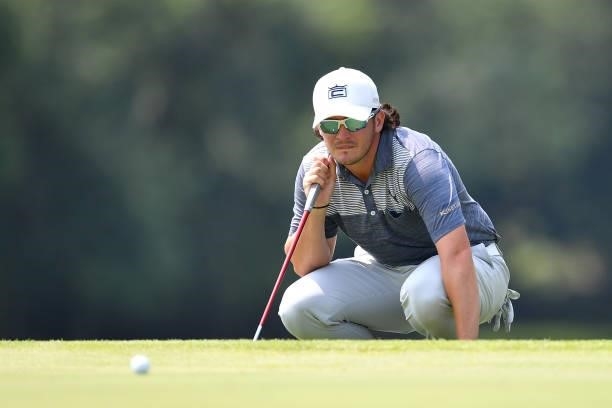 Ewen Ferguson of Scotland of Italy lines up a put on the 5th hole during the Day Two of Italian Challenge at Margara Golf Club on July 23, 2021 in...