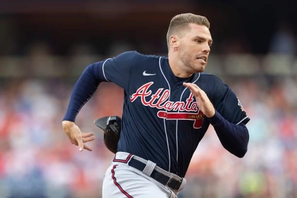 Freddie Freeman of the Atlanta Braves runs to third base in the top of the first inning against the Philadelphia Phillies at Citizens Bank Park on...