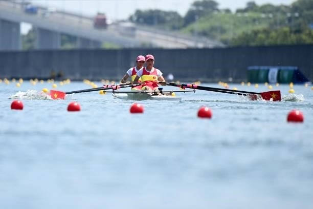 Vietnam's Thi Thao Luong and Vietnam's Thi Hao Dinh compete in the lightweight women's double sculls heats during the Tokyo 2020 Olympic Games at the...