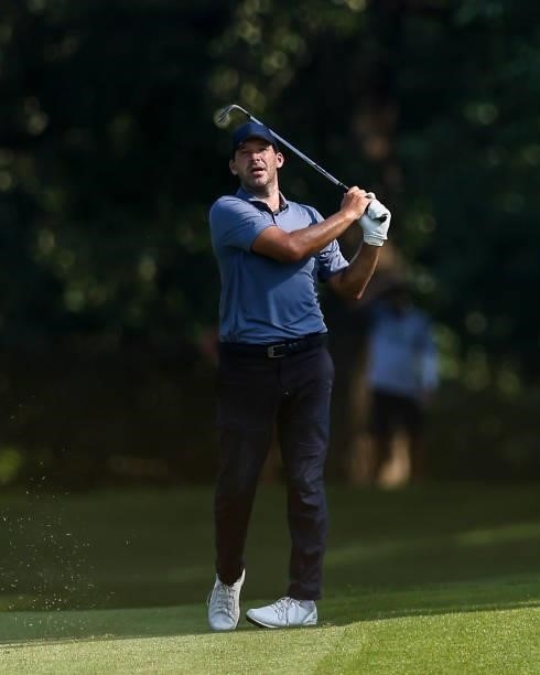 Tony Romo, former NFL quarterback, plays his shot from the 10th hole during the second round of the Price Cutter Charity Championship presented by...