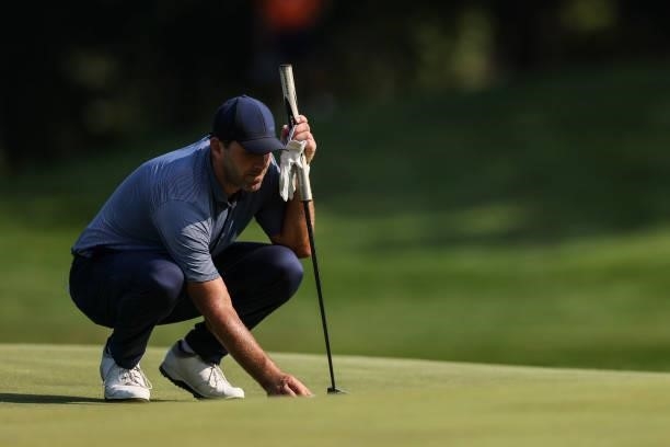Tony Romo, former NFL quarterback, lines up his putt on the 10th green during the second round of the Price Cutter Charity Championship presented by...