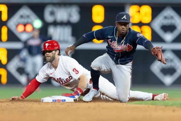 Bryce Harper of the Philadelphia Phillies steals second base past Ozzie Albies of the Atlanta Braves in the bottom of the fifth inning at Citizens...