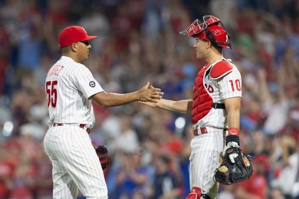 Ranger Suarez of the Philadelphia Phillies celebrates with J.T. Realmuto after defeating the Atlanta Braves at Citizens Bank Park on July 23, 2021 in...