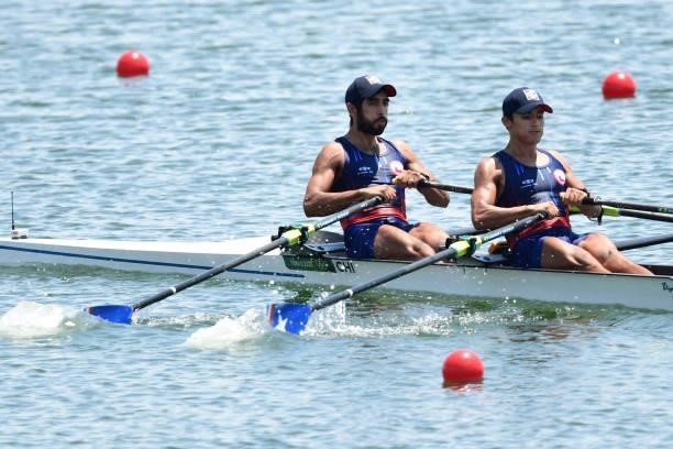 Chile's Cesar Abaroa and Chile's Eber Sanhueza compete in the lightweight men's double sculls heats during the Tokyo 2020 Olympic Games at the Sea...