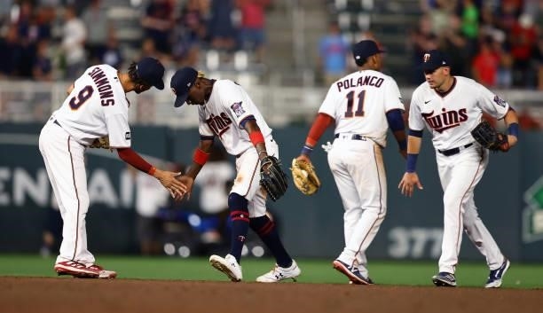 Andrelton Simmons, Nick Gordon, Jorge Polanco and Trevor Larnach of the Minnesota Twins celebrate the win against the Los Angeles Angels at Target...