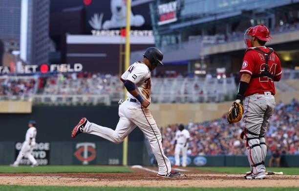 Jorge Polanco of the Minnesota Twins scores a run in the third inning against the Los Angeles Angels at Target Field on July 23, 2021 in Minneapolis,...
