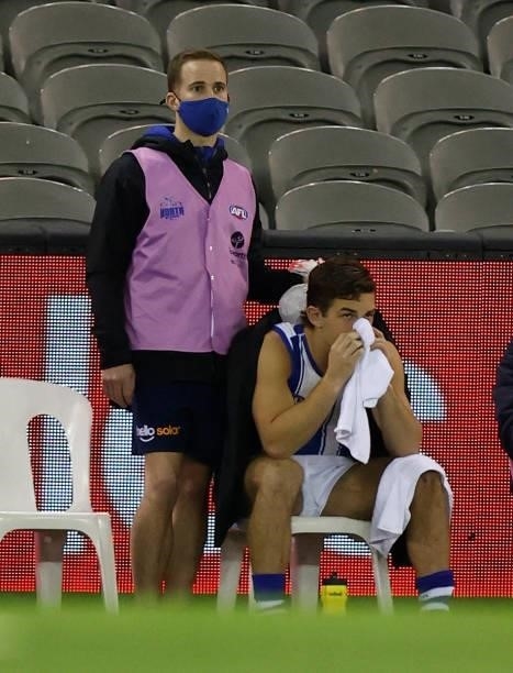 Will Phillips of the Kangaroos looks on after being subbed from the bench during the 2021 AFL Round 19 match between the Carlton Blues and the North...