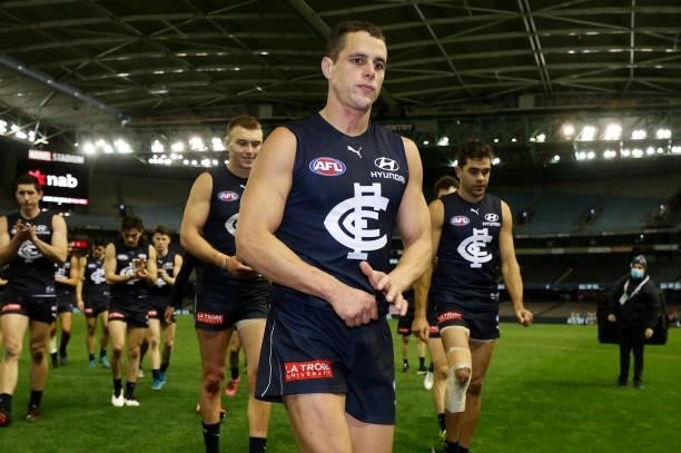 Ed Curnow of the Blues leaves the field after his 200th match during the 2021 AFL Round 19 match between the Carlton Blues and the North Melbourne...