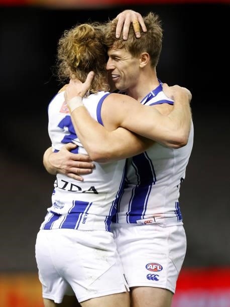 Jed Anderson and Trent Dumont of the Kangaroos celebrate during the 2021 AFL Round 19 match between the Carlton Blues and the North Melbourne...