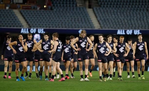 The Blues look dejected after a loss during the 2021 AFL Round 19 match between the Carlton Blues and the North Melbourne Kangaroos at Marvel Stadium...