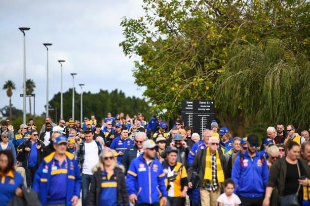 Fans make their way to the stadium during the 2021 AFL Round 19 match between the West Coast Eagles and the St Kilda Saints at Optus Stadium on July...